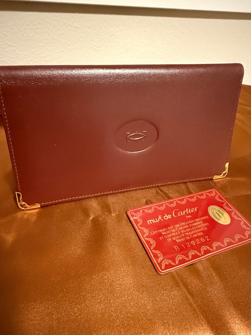 Cartier Burgundy Leather Slim Wallet with Gold Corners